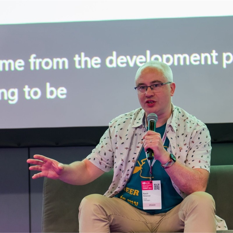 Kevin McDonnell posing on stage on a panel